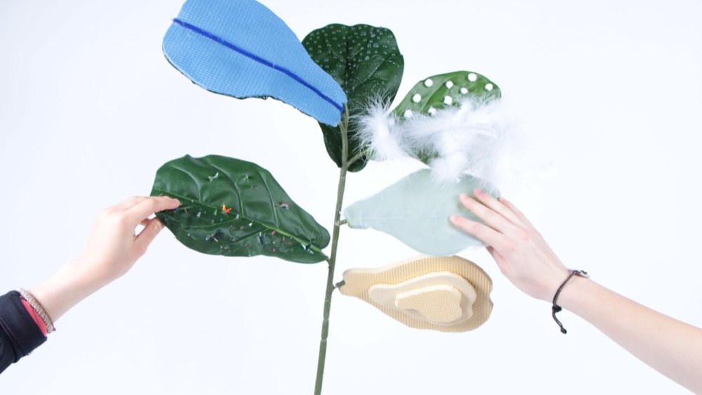 The Living Dress, a garment carrying living plants, worn on the shoulder