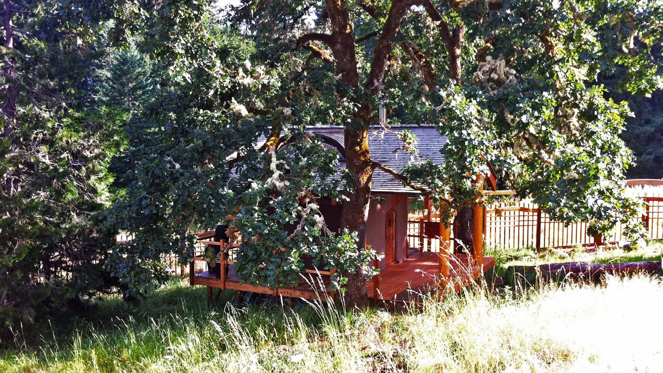 Bliss Farms Sauna raised on posts among oak trees in Eugene, Oregon